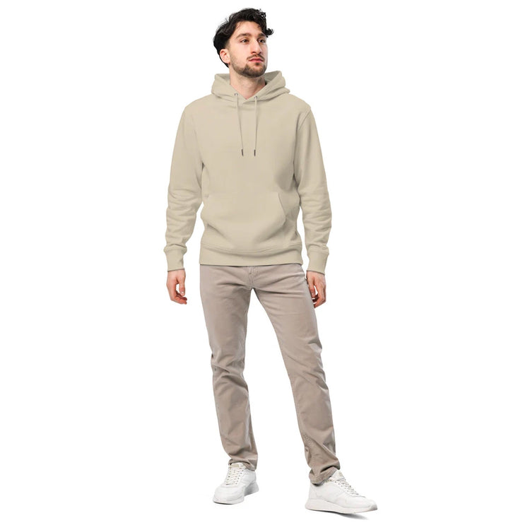 Ein Mann trägt einen beigen Hoodie mit individuell bedrucktem Design. Der Hoodie hat eine große Kapuze mit Kordelzug und eine bequeme Passform. Kombiniert mit einer beigen Hose und weißen Sneakern ergibt sich ein lässiger, moderner Look. Perfekt für einen minimalistischen und stilvollen Streetwear-Stil.