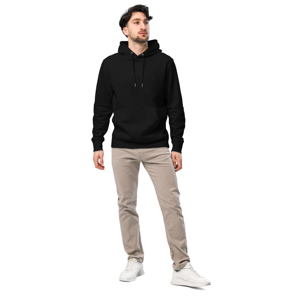 Ein Mann trägt einen klassischen schwarzen Hoodie mit Kapuze und Kordelzug. Er kombiniert den Hoodie mit einer beigefarbenen Hose und weißen Sneakern. Das schlichte Design macht den Kapuzenpullover vielseitig einsetzbar für Freizeit und Alltag. Der Hoodie ist individuell bedruckbar und eignet sich perfekt für personalisierte Designs oder schlichte Streetwear-Looks.