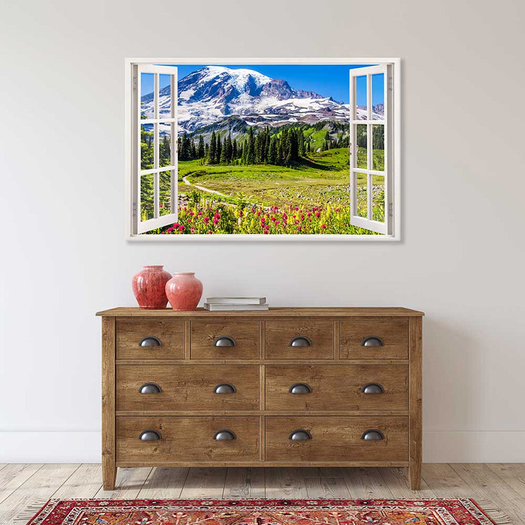 Leinwandbild Fensterblick "Berge und Wildblumen" über Holzkommode