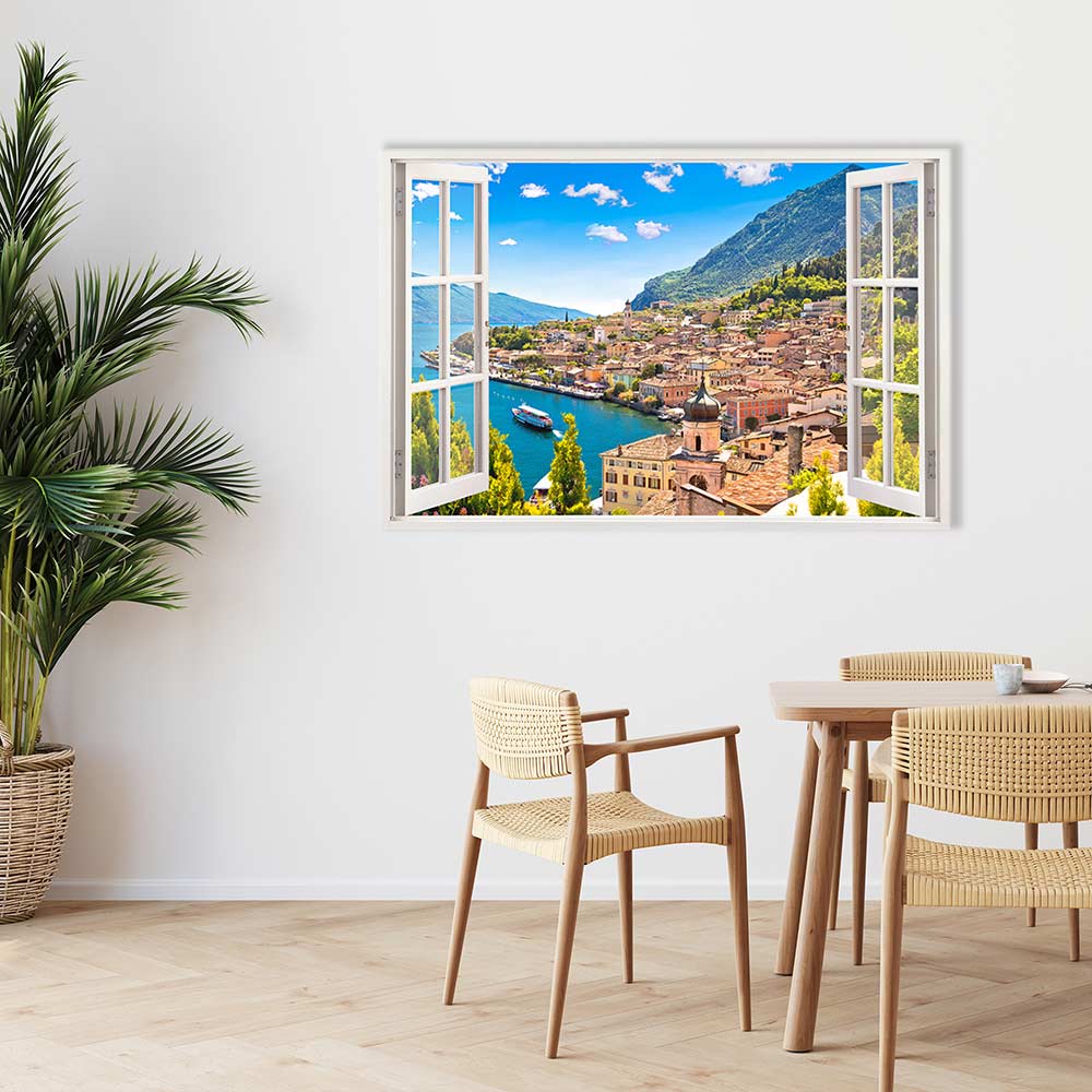 Leinwandbild Fensterblick "Dorf am See" neben Tisch mit Stühlen