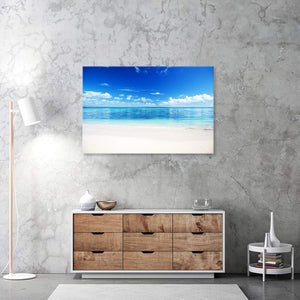 Leinwandbild "Strand und Meer" an grauer Wand über Sideboard